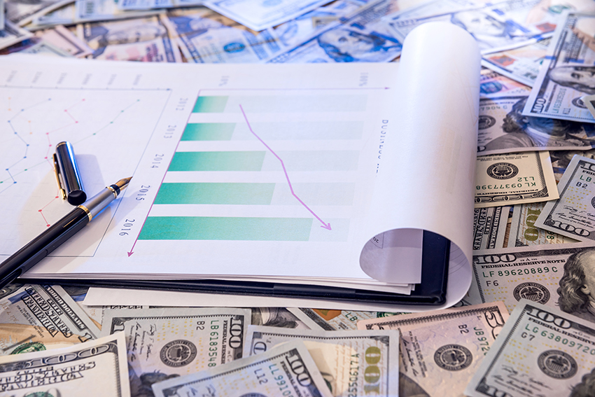 business graph with a pen on dollar.