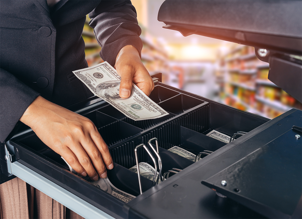 USD cashier hands and bills